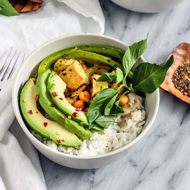 Coconut Basil Tofu simmering in a light broth